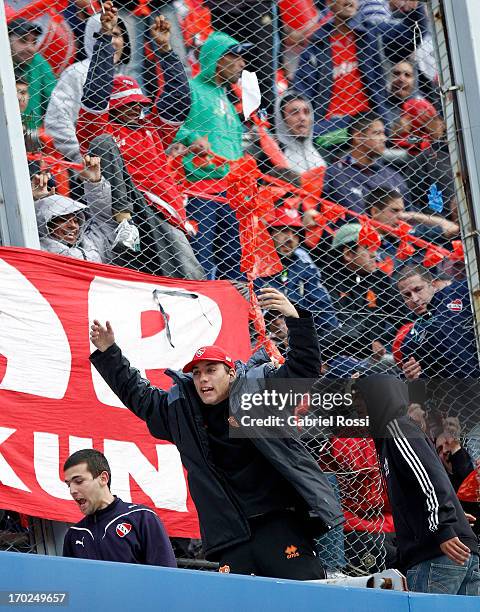 Supporters of Independiente react after a match between River Plate and Independiente as part of the Torneo Final 2013 at the Monumental Vespusio...