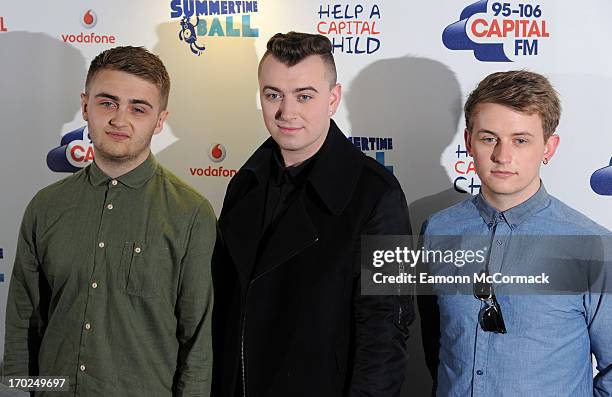 Sam Smith, Howard Lawrence and Guy Lawrence pose in the Media Room at the Capital Summertime Ball at Wembley Arena on June 9, 2013 in London, England.
