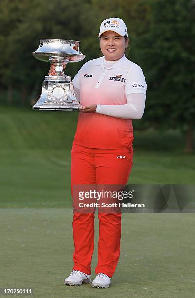 Inbee Park of South Korea poses with the trophy after winning the Wegmans LPGA Championship at Locust Hill Country Club on June 9, 2013 in Pittsford,...