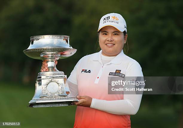 Inbee Park of South Korea poses with the trophy after winning the Wegmans LPGA Championship at Locust Hill Country Club on June 9, 2013 in Pittsford,...