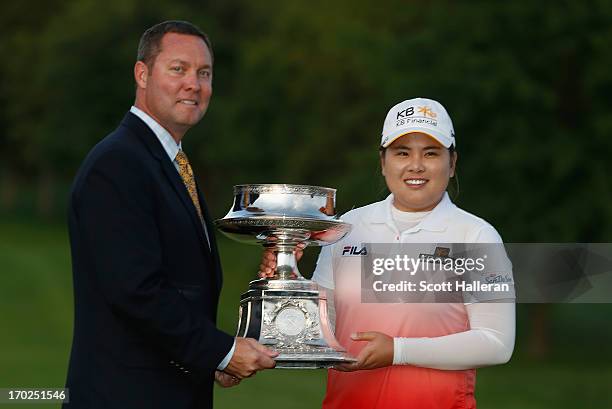 Commissioner Mike Whan poses with Inbee Park of South Korea after Park won the Wegmans LPGA Championship at Locust Hill Country Club on June 9, 2013...