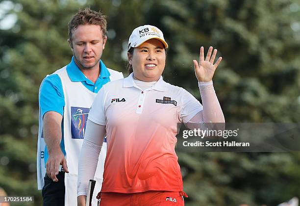 Inbee Park of South Korea celebrates after defeating Catriona Matthew on the third playoff hole alongside her caddie Brad Beecher during the final...