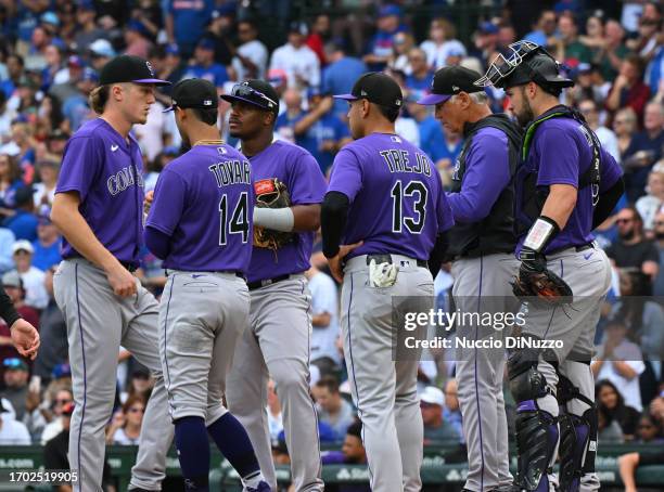 Manager Bud Black of the Colorado Rockies visits the mound for a pitching change during a game against the Chicago Cubs at Wrigley Field on September...