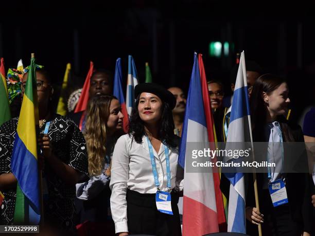 Delegates take part in the flag ceremony during the One Young World opening ceremony on October 2, 2023 in Belfast, Northern Ireland. The annual...