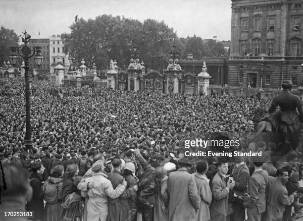 The crowd outside Buckingham Palace cheer for the Royal Family after the Coronation, London, 2nd June 1953.