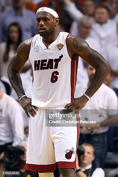 LeBron James of the Miami Heat looks on in the first half while taking on the San Antonio Spurs during Game Two of the 2013 NBA Finals at...