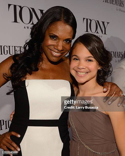 Actress Audra McDonald and Zoe Madeline Donovan attend The 67th Annual Tony Awards at Radio City Music Hall on June 9, 2013 in New York City.