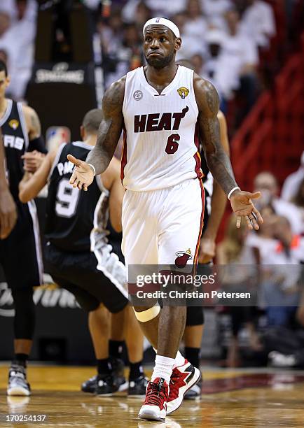 LeBron James of the Miami Heat reacts in the third quarter while taking on the San Antonio Spurs during Game Two of the 2013 NBA Finals at...