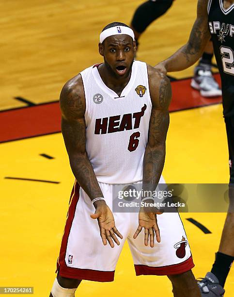 LeBron James of the Miami Heat reacts in the third quarter while taking on the San Antonio Spurs during Game Two of the 2013 NBA Finals at...