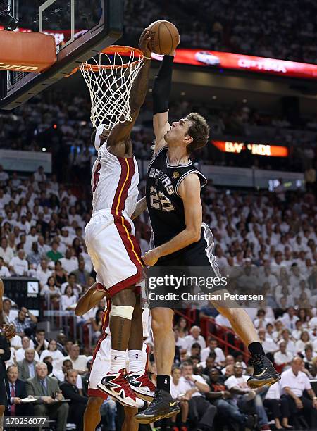 LeBron James of the Miami Heat blocks the shot of Tiago Splitter of the San Antonio Spurs in the fourth quarter during Game Two of the 2013 NBA...