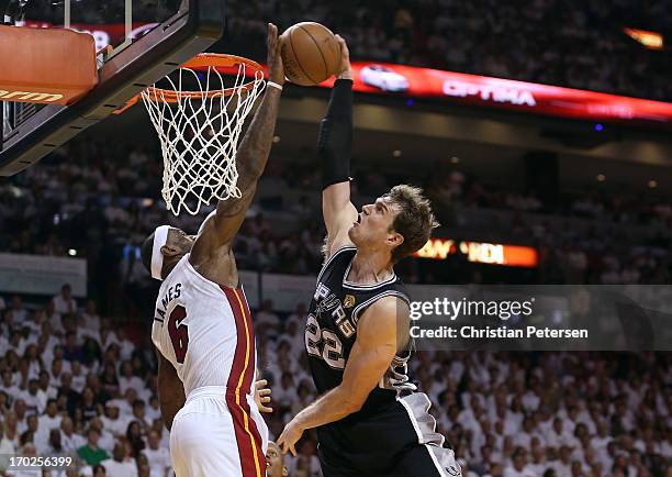 LeBron James of the Miami Heat blocks the shot of Tiago Splitter of the San Antonio Spurs in the fourth quarter during Game Two of the 2013 NBA...