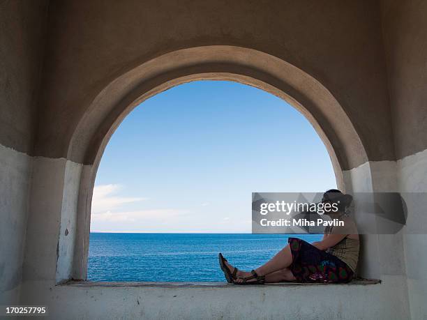 woman enjoying view over mediterranean sea - 33 arches stock pictures, royalty-free photos & images