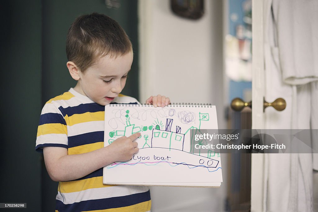 Young boy with his drawing