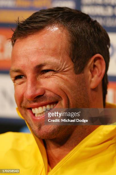 Socceroos Captain Lucas Neill reacts when speaking to the media during an Australian Socceroos press conference at Etihad Stadium on June 10, 2013 in...