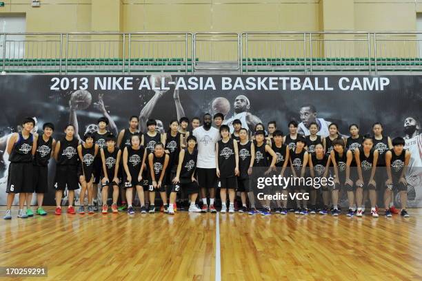 American professional basketball player James Harden of Houston Rockets poses for photo with fans on June 8, 2013 in Guangzhou, Guangdong Province of...
