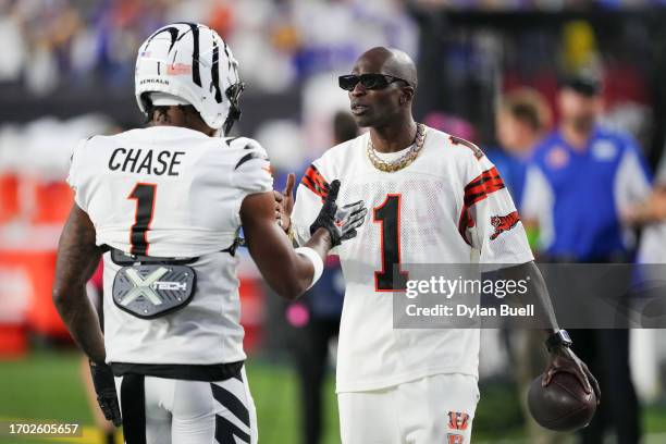 Ja'Marr Chase of the Cincinnati Bengals meets with former Cincinnati Bengals player Chad Ochocinco Johnson before the game against the Los Angeles...