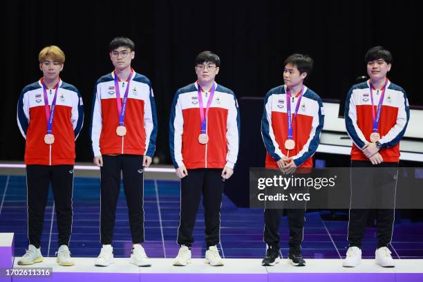 Bronze medalists Team Thailand pose during the medal ceremony for the Esports - Arena of Valor Asian Games Version Final on day three of the 19th...