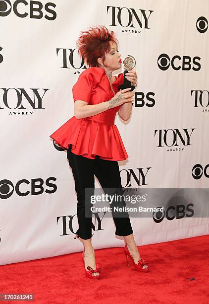 Composer Cyndi Lauper, winner of the award for Best Original Score Written for the Theatre 'Kinky Boots' poses in The 67th Annual Tony Awards at...