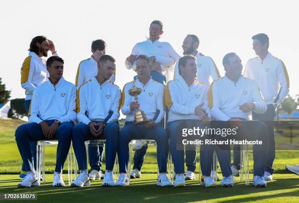 Rory McIlroy is lifted up by Shane Lowry as the European Team assemble for their team photo during the European Team Portraits at the 2023 Ryder Cup...