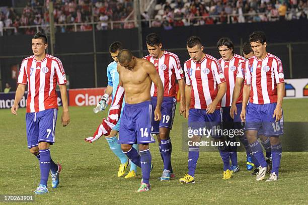 Players of Paraguay leaves the field after the match between Paraguay and Chile as part of the South American Qualifiers for FIFA World Cup Brazil...