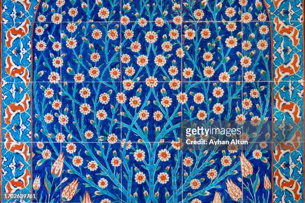 iznik tile panel with blue-and-white and coral-red - ottoman empire stock pictures, royalty-free photos & images
