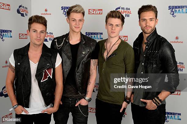 Adam Pitts, Ryan Fletcher, Joel Peat and Andy Brown of Lawson pose in a backstage studio during the Capital Summertime Ball at Wembley Stadium on...