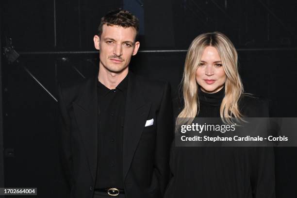 Niels Schneider and Virginie Efira attends the Saint Laurent Womenswear Spring/Summer 2024 show as part of Paris Fashion Week on September 26, 2023...