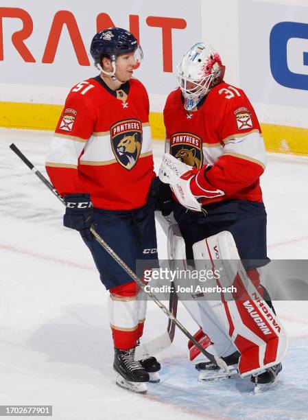 Goaltender Ludovic Waeber and Marek Alscher of the Florida Panthers celebrate the 5-0 win against the Nashville Predators during a preseason game at...