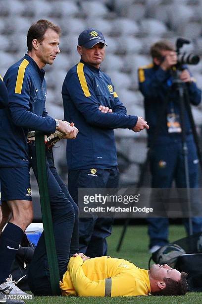 Captain Lucas Neill stretches his legs during an Australian Socceroos training session at Etihad Stadium on June 10, 2013 in Melbourne, Australia.