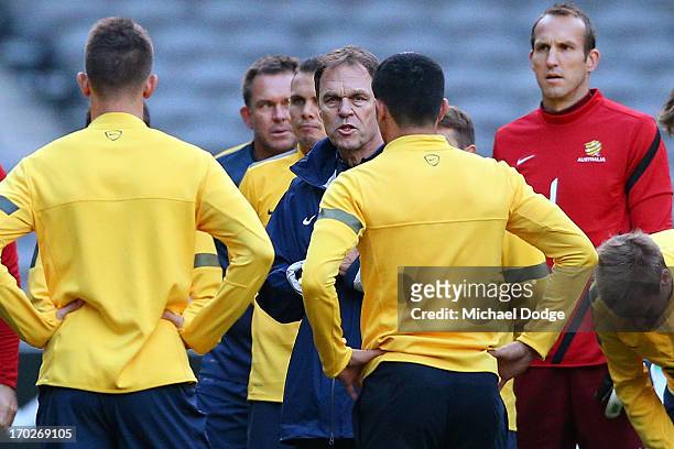 Socceroos coach Holger Osieck speaks to his players during an Australian Socceroos training session at Etihad Stadium on June 10, 2013 in Melbourne,...