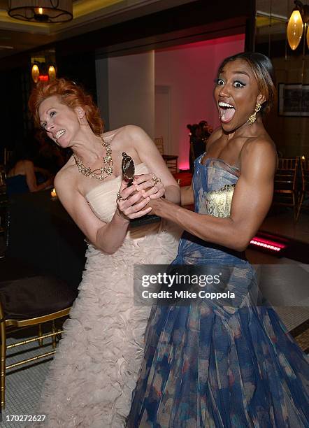 Actors Carolee Carmello and Patina Miller pretend to fight over a Tony Award on June 9, 2013 in New York City.