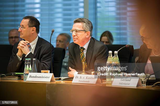 German Defense Minister Thomas de Maiziere joins committee chairperson Susanne Kastner to answer questions from parliamentarians at the Bundestag...