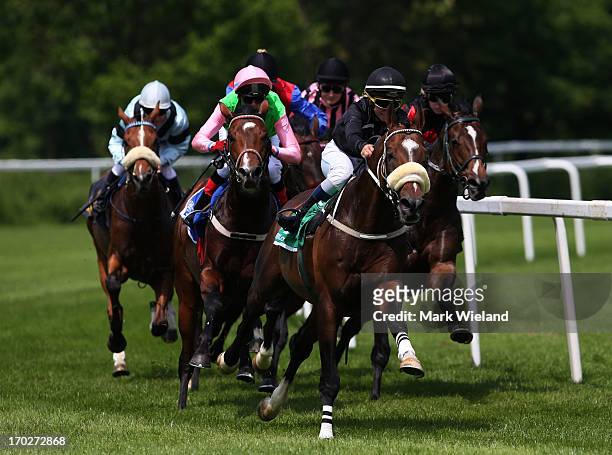 Lignon's Hero ridden by Liam Jones leads the field in the Preis der Lotterie Super 6 during the Lotto Festival 2013 at Galopp Munich on June 9, 2013...