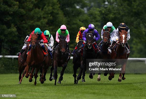 Lord Sholokhov ridden by Tamara Hofer leads the field in the Preis der Glucks Spirale during the Lotto Festival 2013 at Galopp Munich on June 9, 2013...
