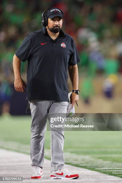 Head coach Ryan Day of the Ohio State Buckeyes looks on against the Notre Dame Fighting Irish during the first half at Notre Dame Stadium on...