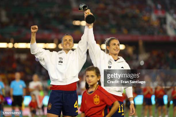 Irene Paredes and Alexia Putellas of Spain lift the Women's FIFA World Cup Trophy prior to the UEFA Women's Nations League Group D match between...