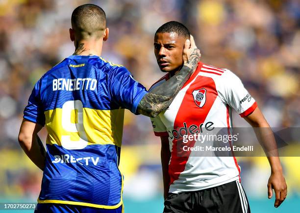 Dario Benedetto of Boca Juniors greets Nicolas De La Cruz of River Plate during a match between Boca Juniors and River Plate as part of Copa de la...