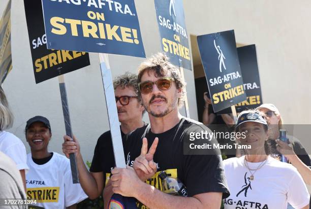 Pedro Pascal walks the picket line with striking SAG-AFTRA members outside Warner Bros. Studio as the actors strike continues on September 26, 2023...