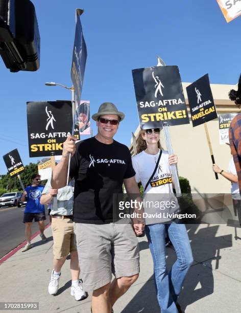 Diedrich Bader and Dulcy Rogers join the picket line outside Paramount Studios on September 26, 2023 in Los Angeles, California. The WGA has reached...