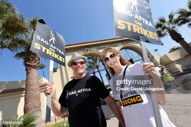 Diedrich Bader and Dulcy Rogers join the picket line outside Paramount Studios on September 26, 2023 in Los Angeles, California. The WGA has reached...