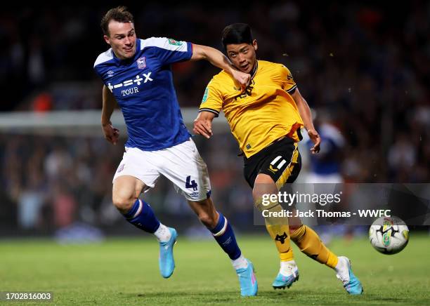 Hee-chan Hwang of Wolverhampton Wanderers battles for possession against George Edmundson of Ipswich Town during the Carabao Cup Third Round match...