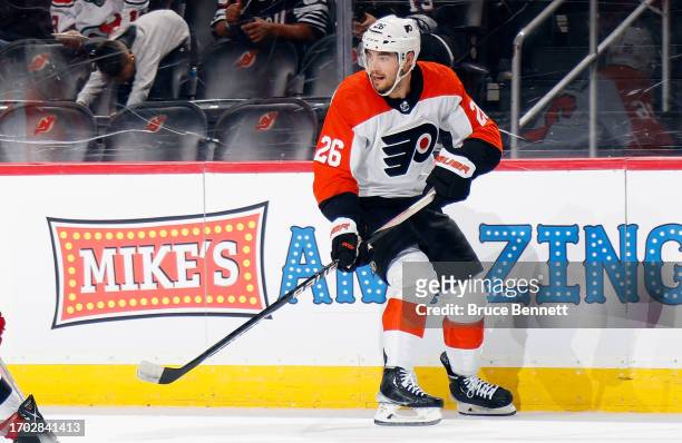 Sean Walker of Philadelphia Flyers skates against the New Jersey Devils at a preseason game at the Prudential Center on September 25, 2023 in Newark,...