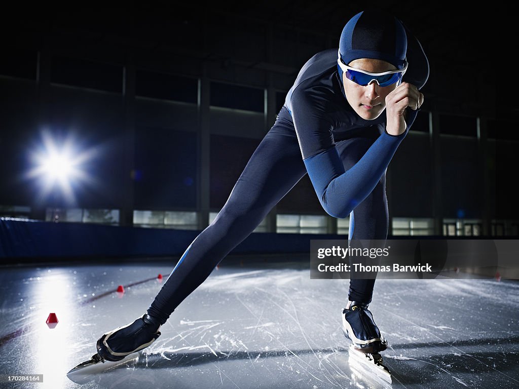 Long track speed skater on track in arena