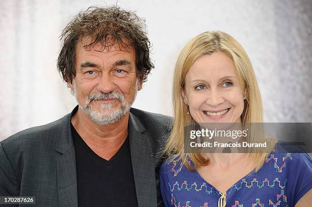 Olivier Marchal and his wife Catherine pose at the 'A Votre Service' photocall during the 53rd Monte Carlo TV Festival on June 10, 2013 in...