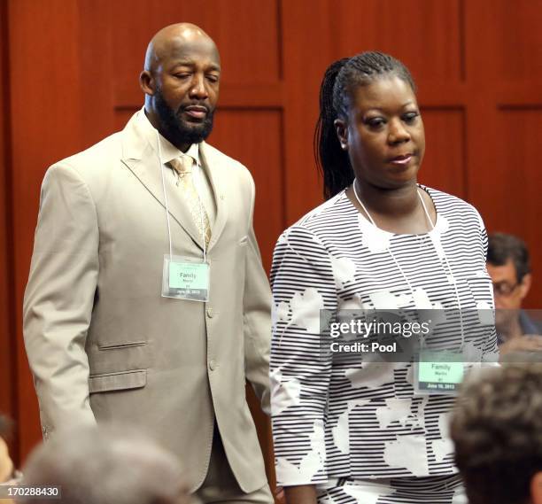 Tracy Martin and Sybrina Fulton, the parents of slain teen Trayvon Martin, arrive in court for the first day of the trial of George Zimmerman, in...