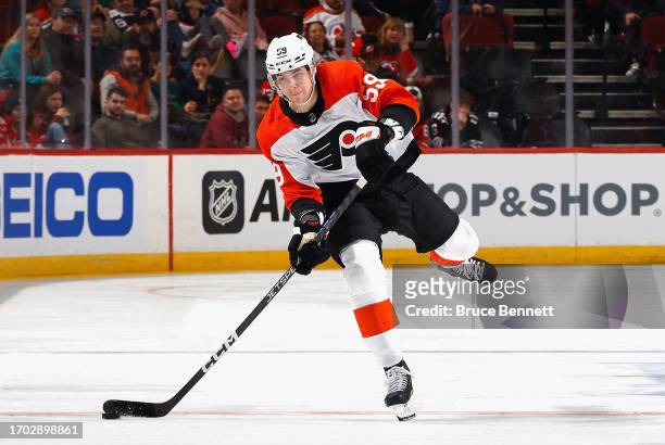 Oliver Bonk of Philadelphia Flyers skates against the New Jersey Devils at a preseason game at the Prudential Center on September 25, 2023 in Newark,...