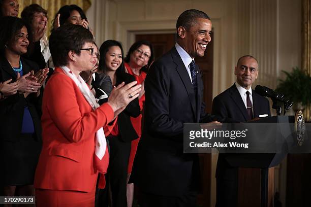 President Barack Obama speaks as CEO of Deloitte Joe Echevarria , senior adviser to the President Valerie Jarrett and equal pay supporters look on...