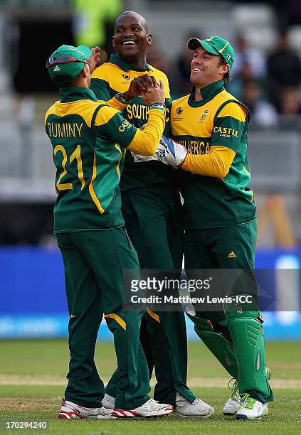 Lonwabo Tsotsobe of South Africa is congratulated by team mates, after catching and bowling Nasir Jamshed of Pakistan during the ICC Champions Trophy...