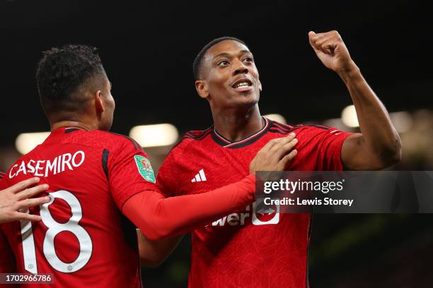 Anthony Martial of Manchester United celebrates with Casemiro after scoring their side's third gocelebrates victory during the Carabao Cup Third...