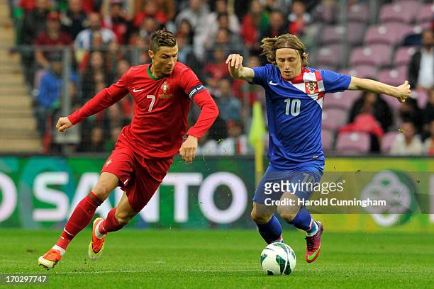 Cristiano Ronaldo of Portugal competes for the ball with Luka Modric of Croatia during the international friendly match between Portugal and Croatia...